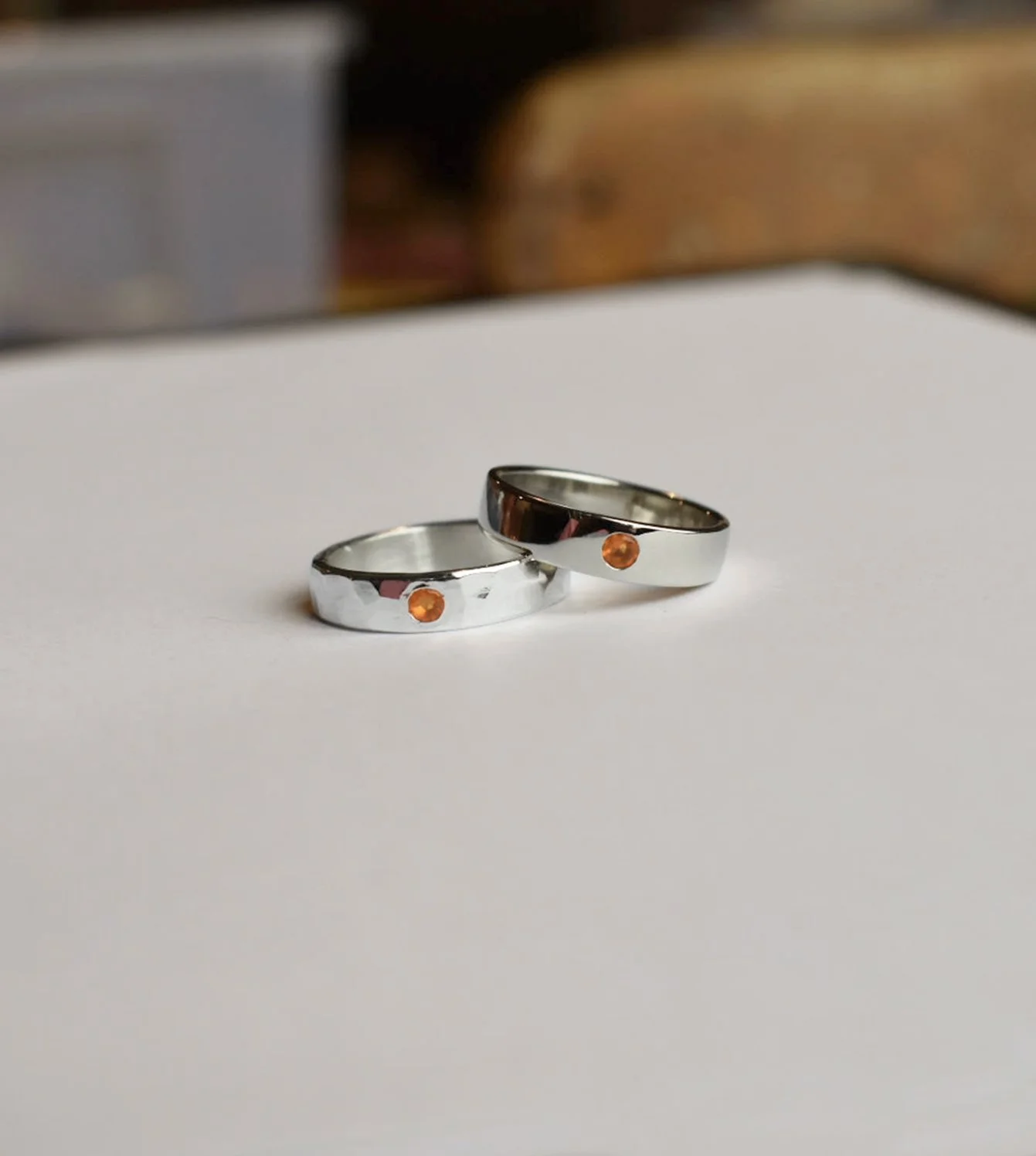 Riki & Mike’s Wedding Bands - Sterling silver bands with flush set Mexican fire opals with a hammer texture and a high polish