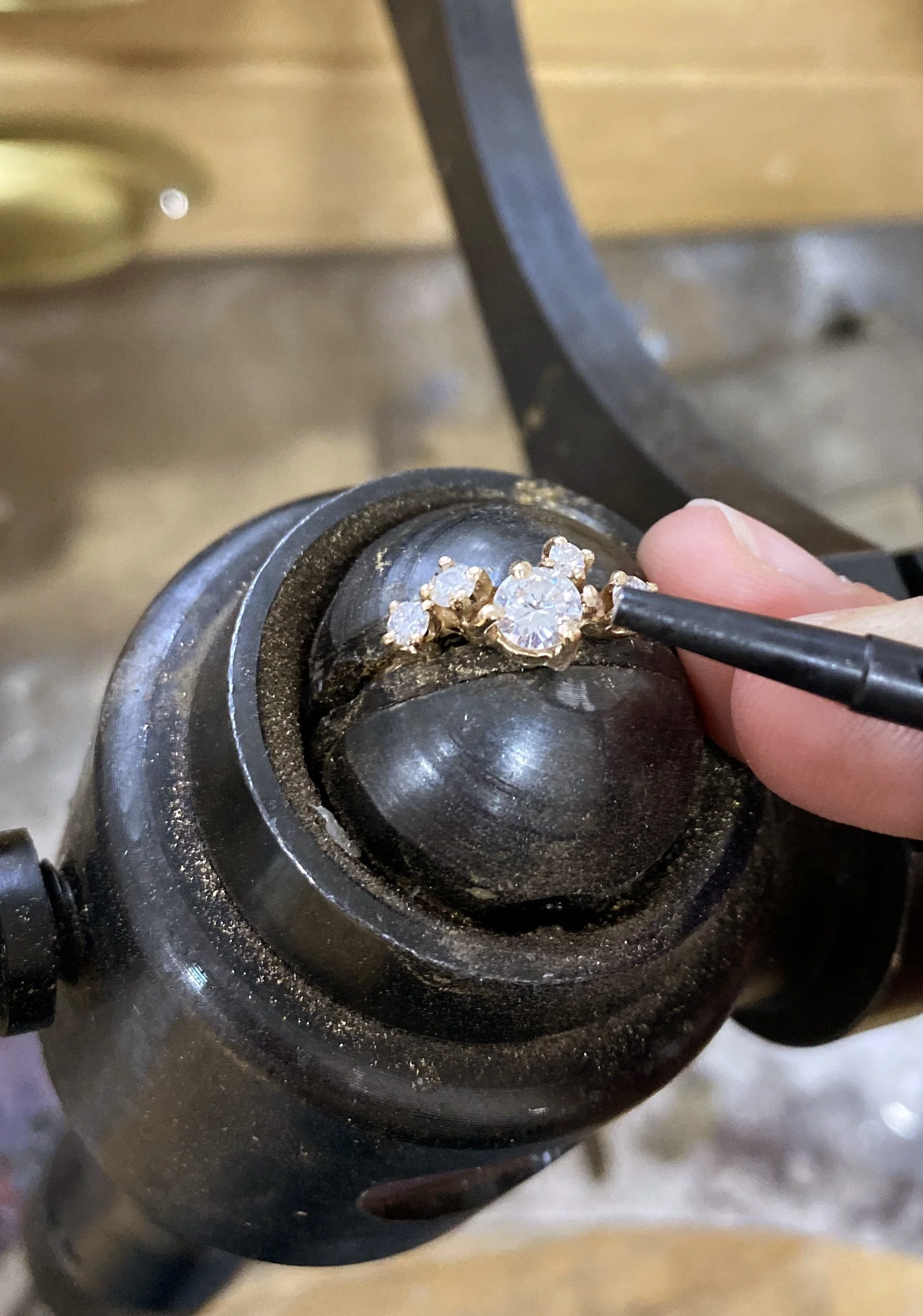 Cluster of diamonds on a ring being set