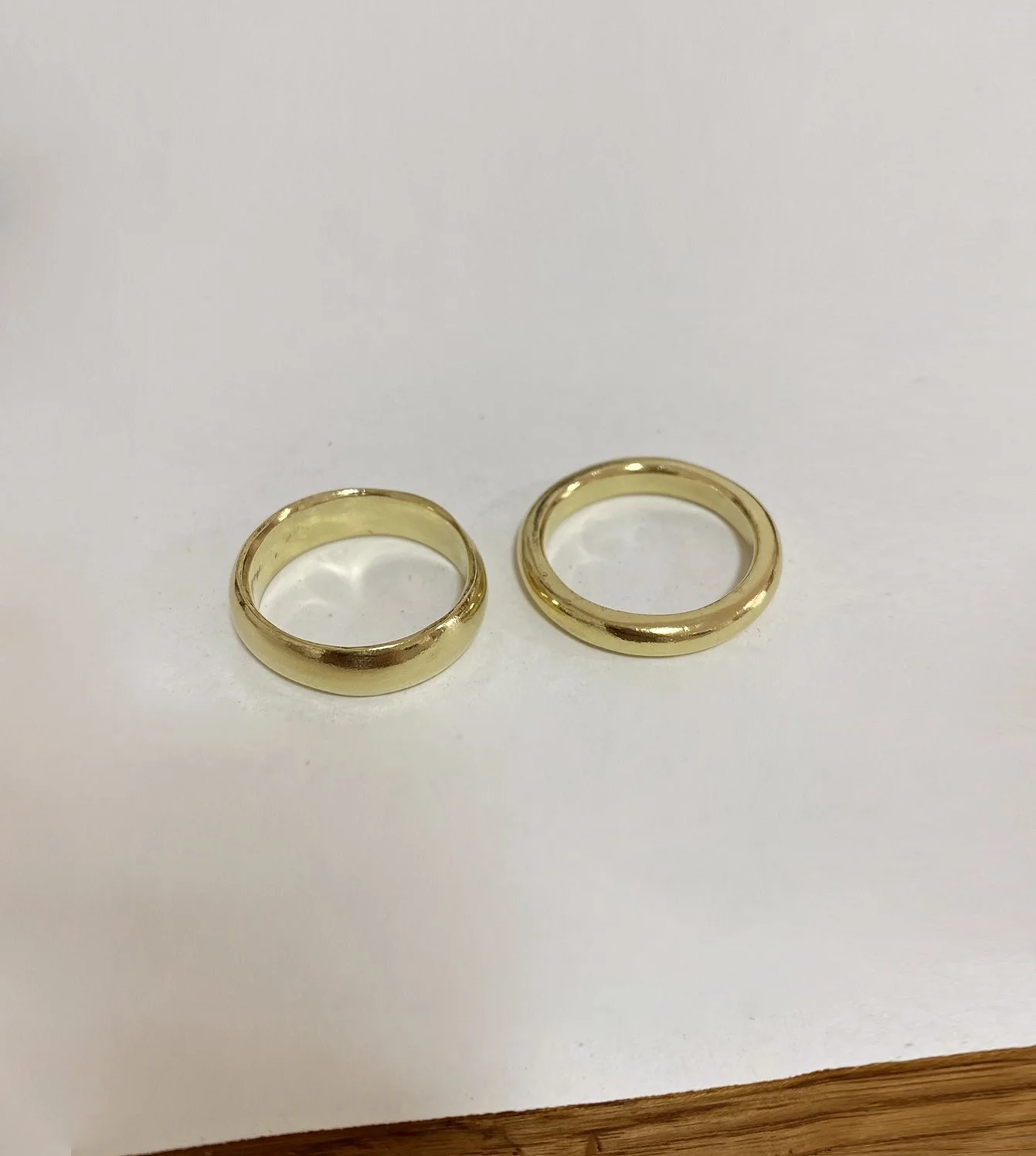 Wedding Bands - 18k gold irregular shape and slightly domed band and an accompanying thick round band
