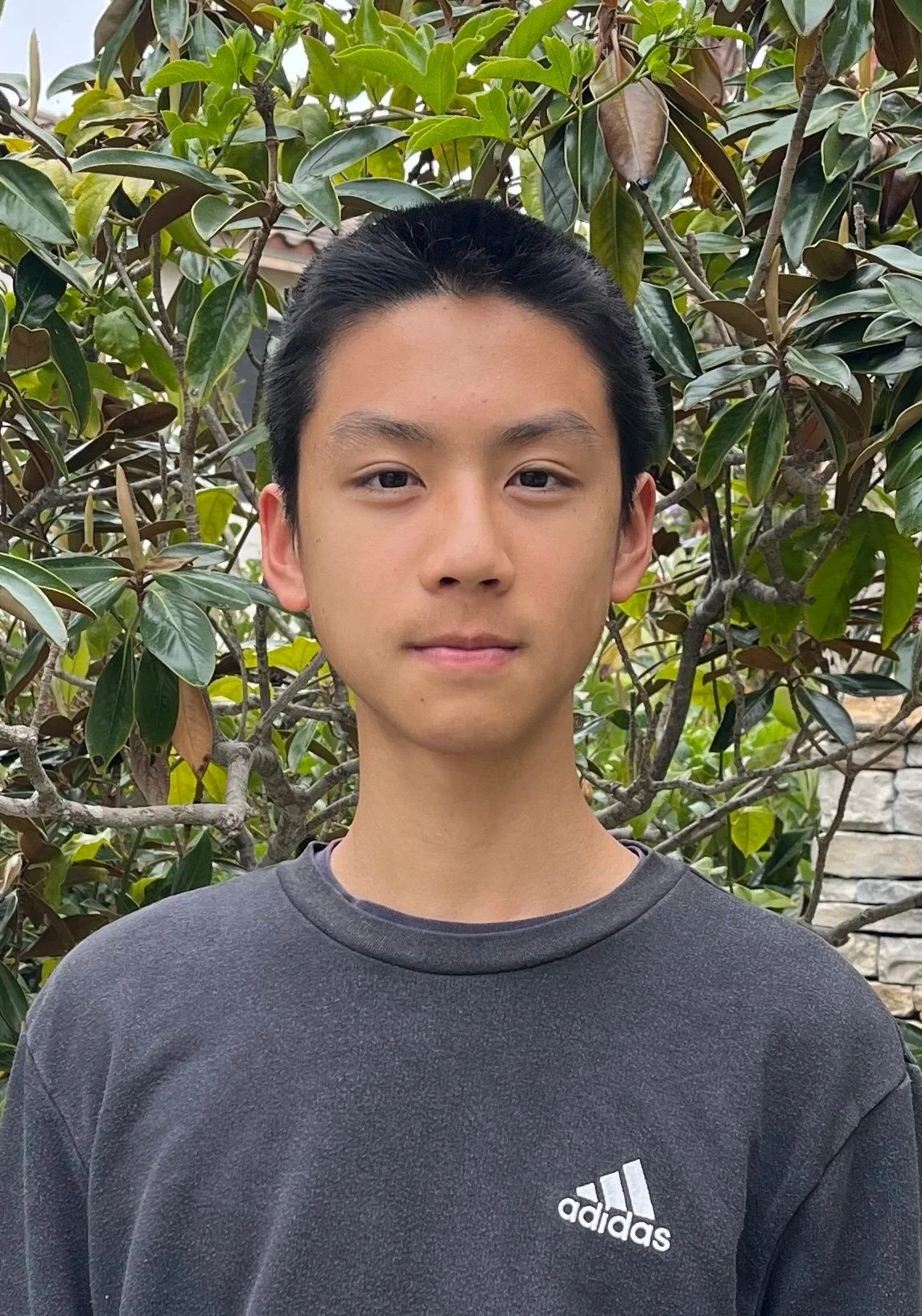 Photo of Michael Sun in front of tree