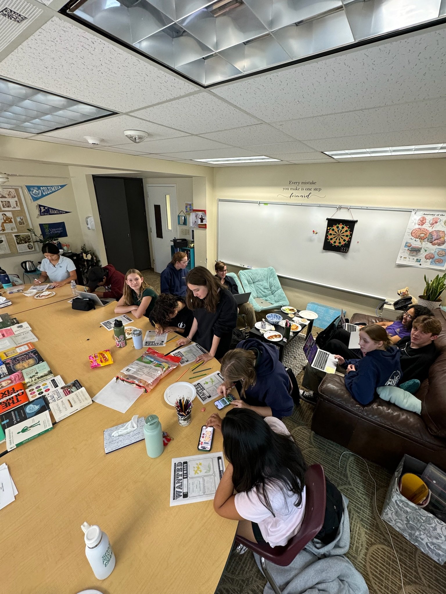 Club members making invasive species wanted posters to spread awareness. 10/25/24