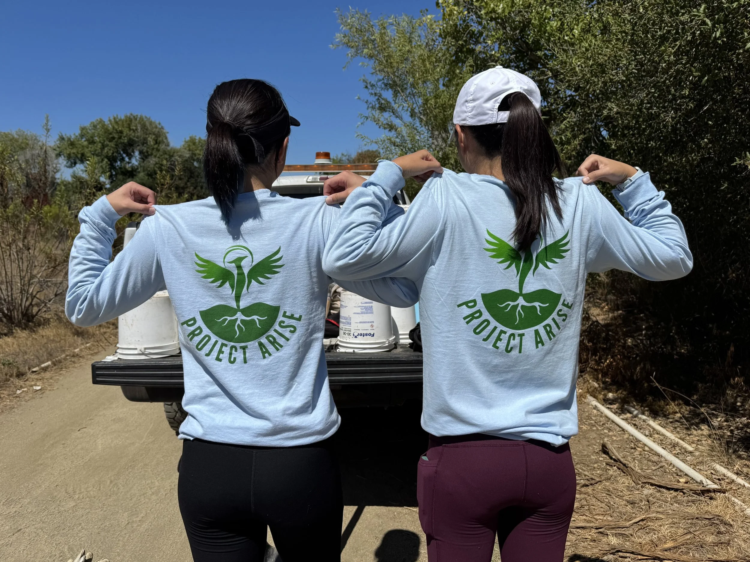 Volunteers sporting our stylish and sun-protective ARISE work shirts! 8/17/25