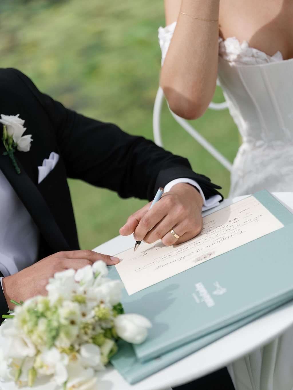 There are very few rules when it comes to signing your marriage paperwork.

For everything else? We can make our own. 

Signing in the rain. 
Sitting or standing.
With your best friends as witnesses, your mums, or your grandparents.
Witnesses by raff