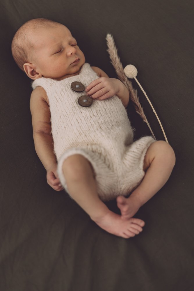 Nicole Johnson Photography ~ Newborn Session, child on olive blanket with botanicals