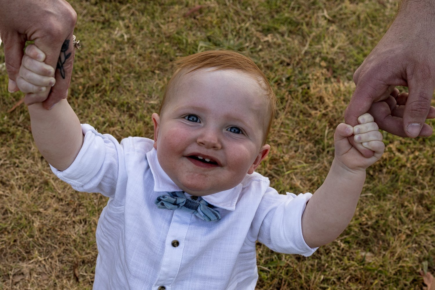 Nicole Johnson Photography ~ Family lifestyle session, Little boy holding parents hands looking at camera