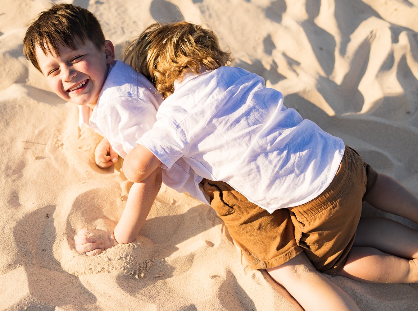 Nicole Johnson Photography ~ Brothers wrestling on sand