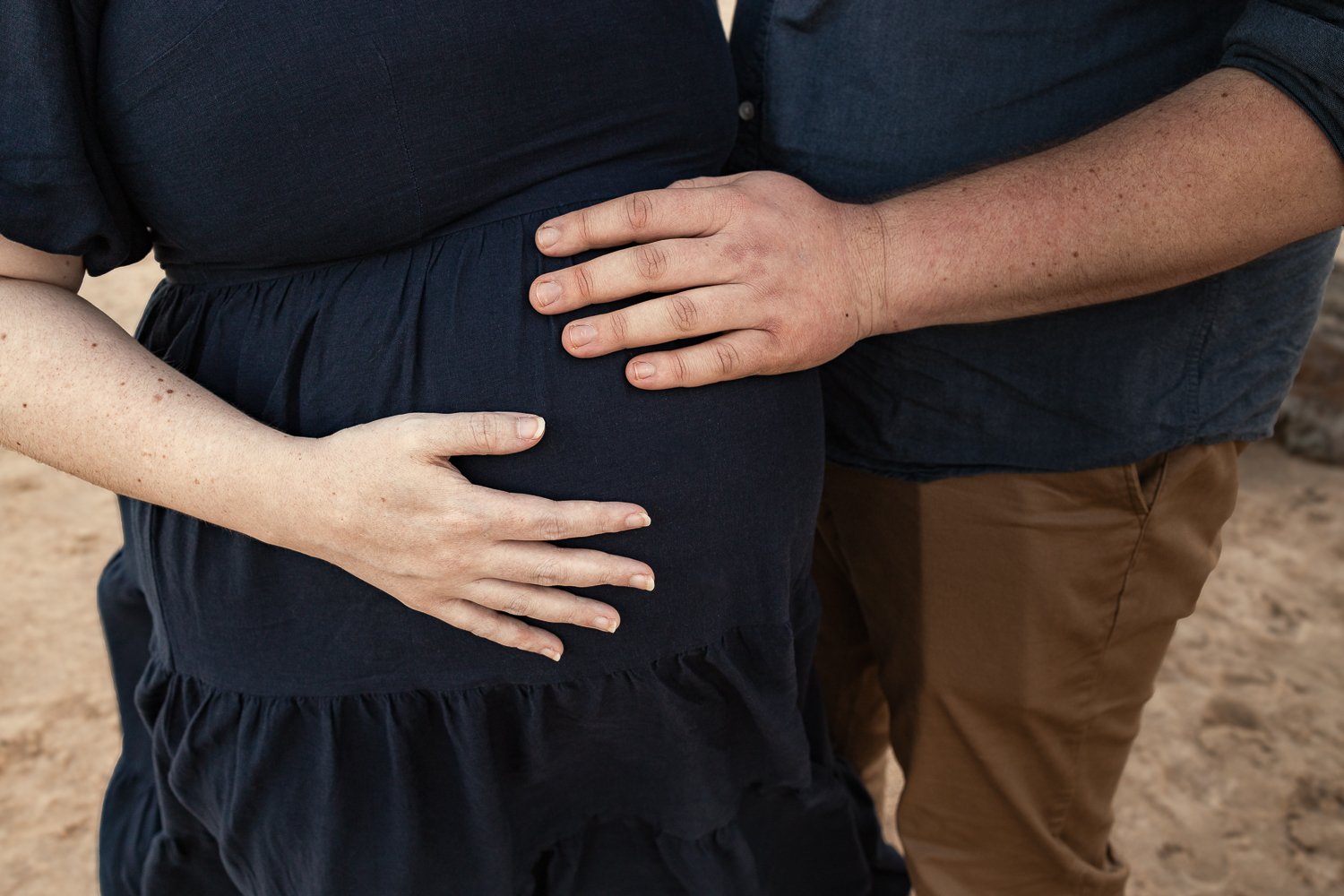 Nicole Johnson Photography ~ Maternity session parents hands on baby bump