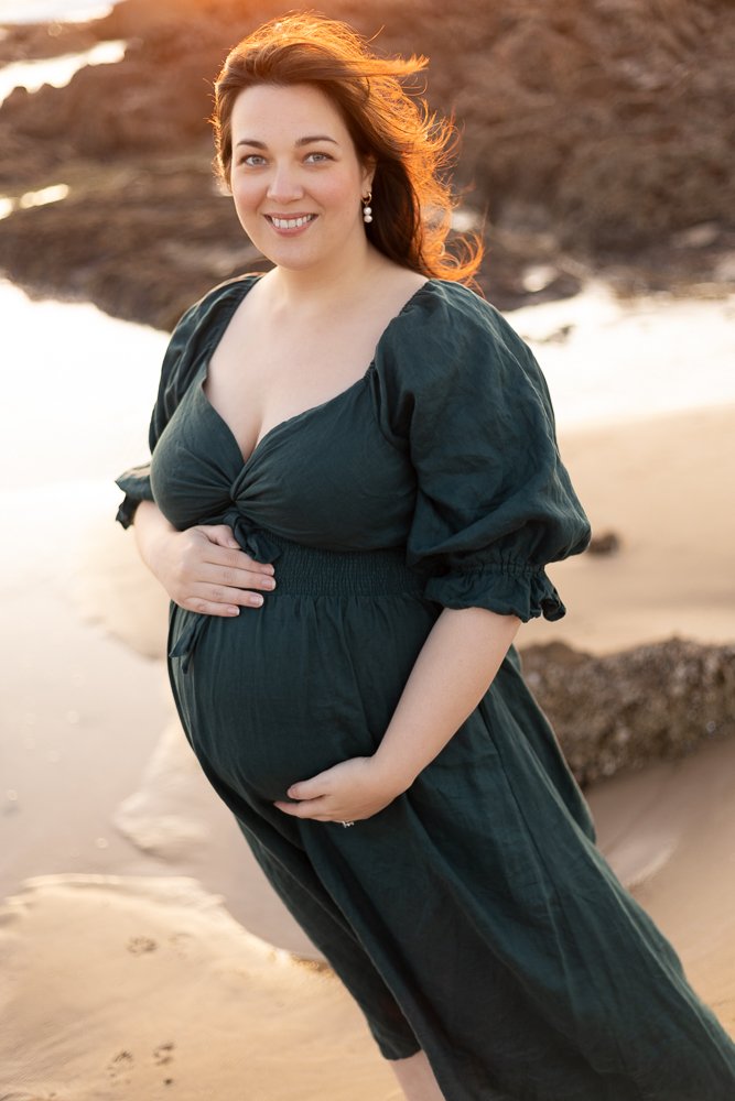Nicole Johnson Photography ~ Maternity session on beach, hands on baby bump