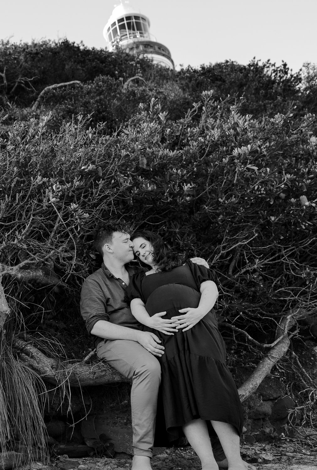 Nicole Johnson Photography ~ Maternity beach session,Black and white with lighthouse in background