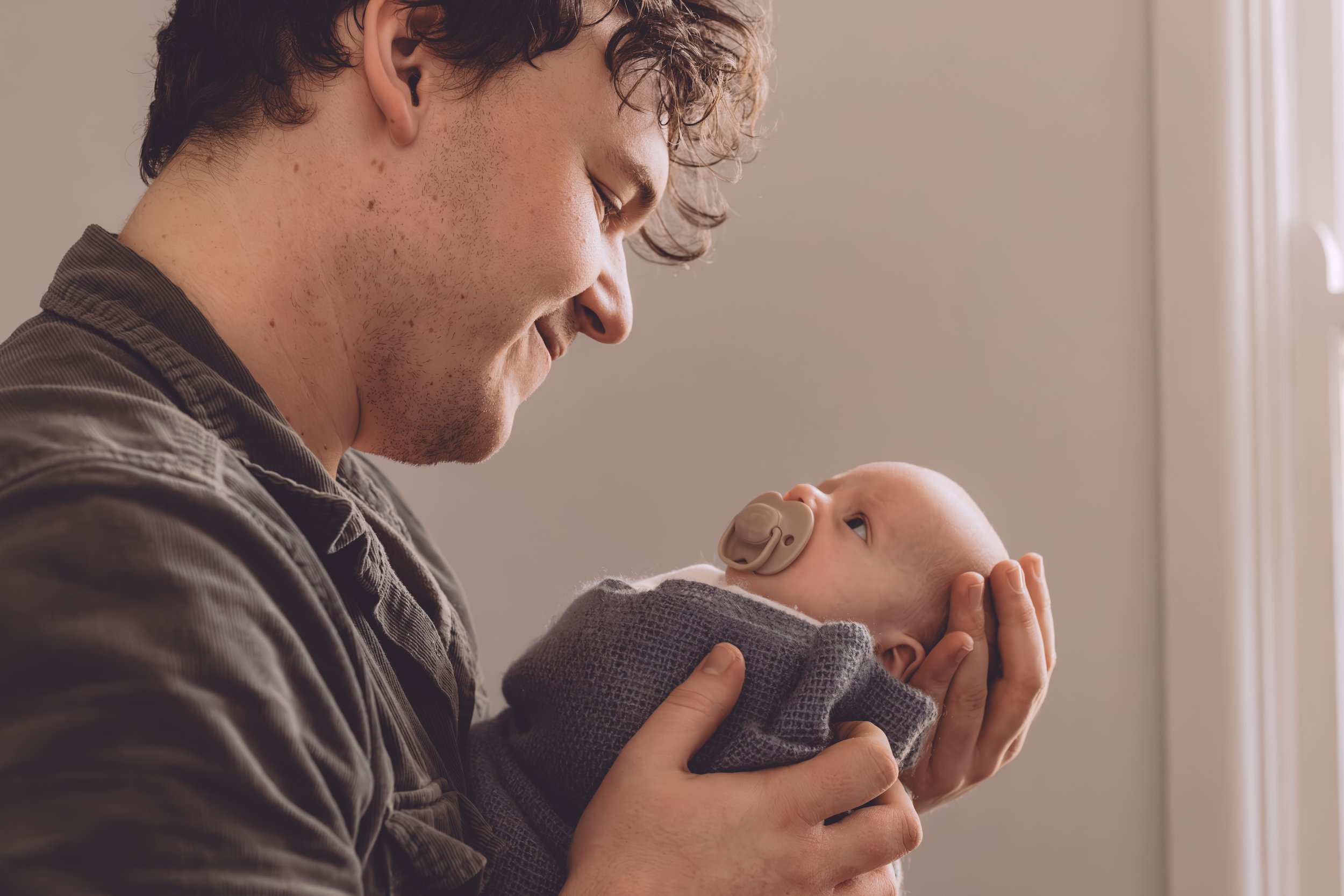 Nicole Johnson Photography ~ Newborn Session Father embracing child