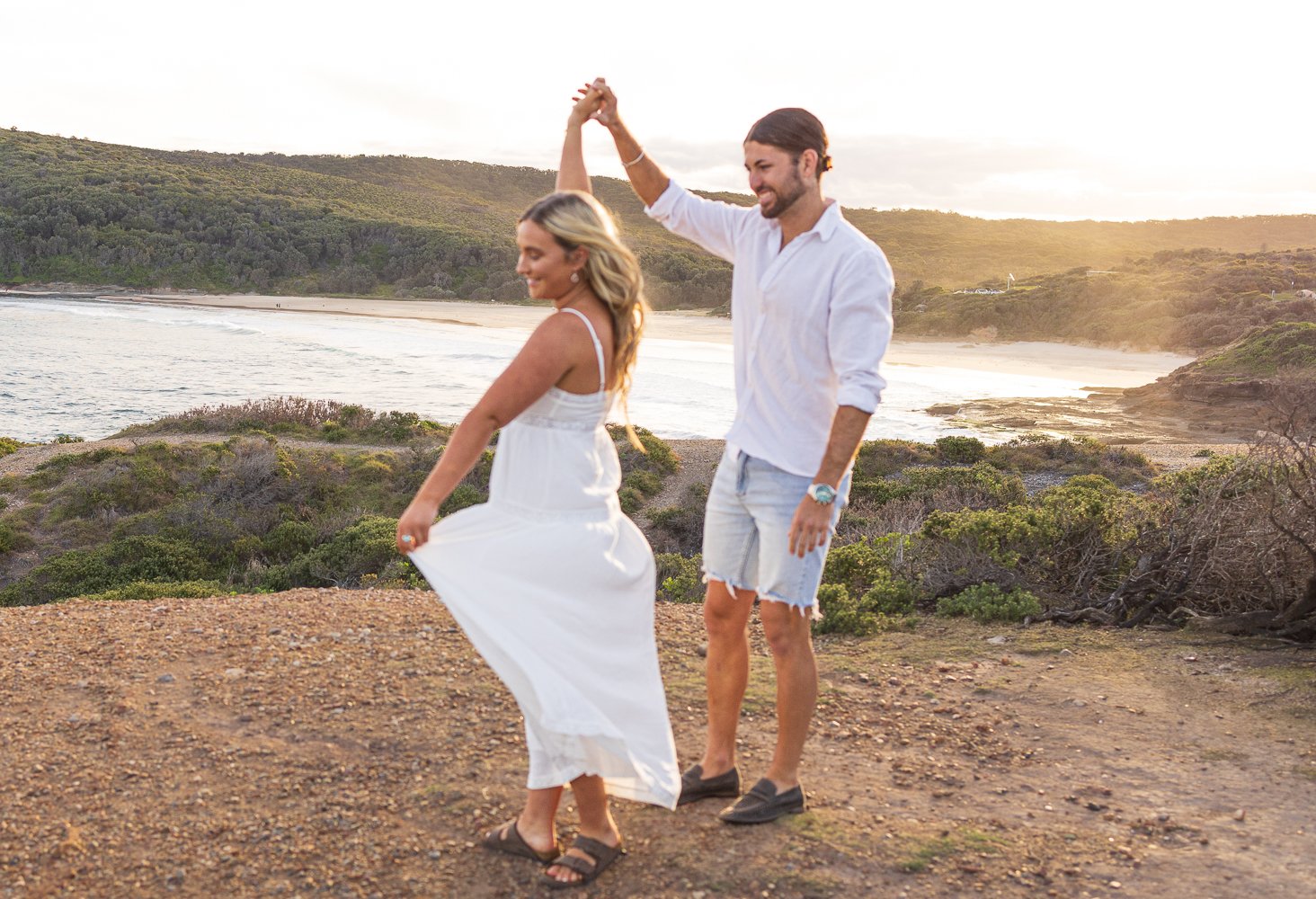 Nicole Johnson Photography ~ Couple session, Woman twirling whilst holding partners hand