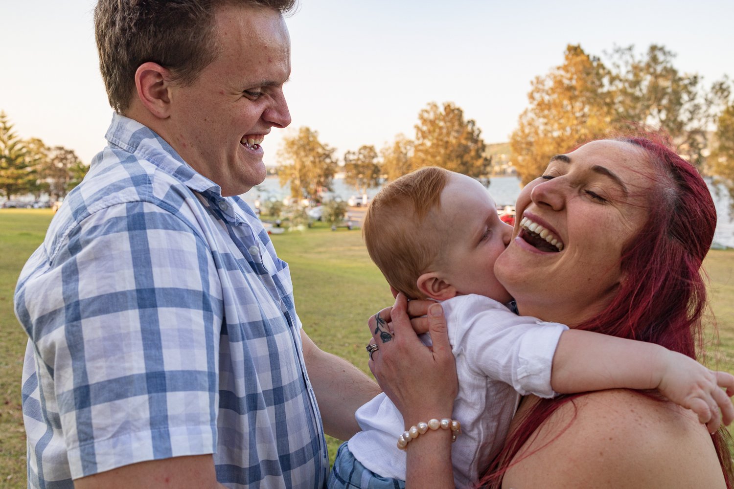Nicole Johnson Photography ~ Family lifestyle session, child embracing mother, father looking on