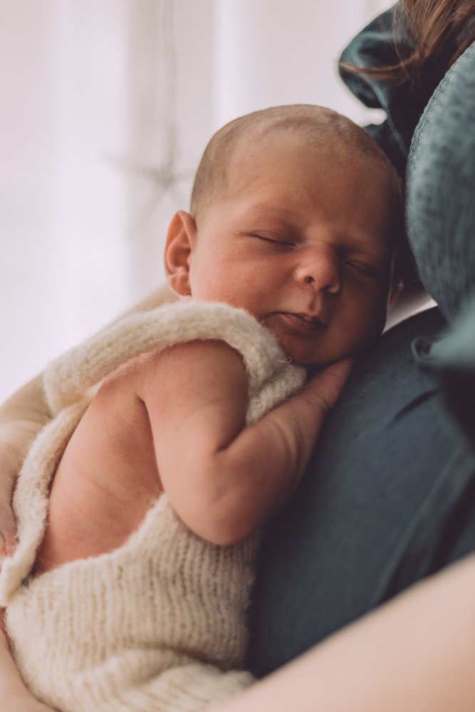 Nicole Johnson Photography ~ Newborn Session, child cuddled up on mothers stomach