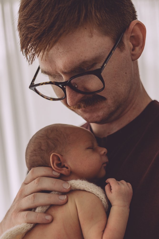 Nicole Johnson Photography ~ Newborn session, Father holding child on chest