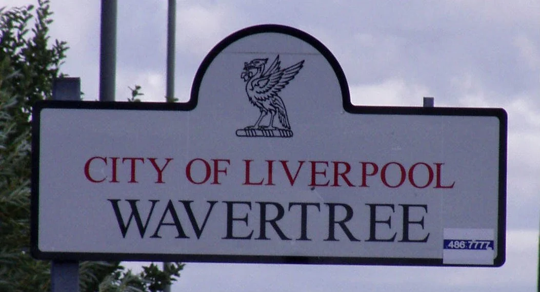 Sign for the City of Liverpool Wavertree with an emblem of a winged lion or griffin at the top.
