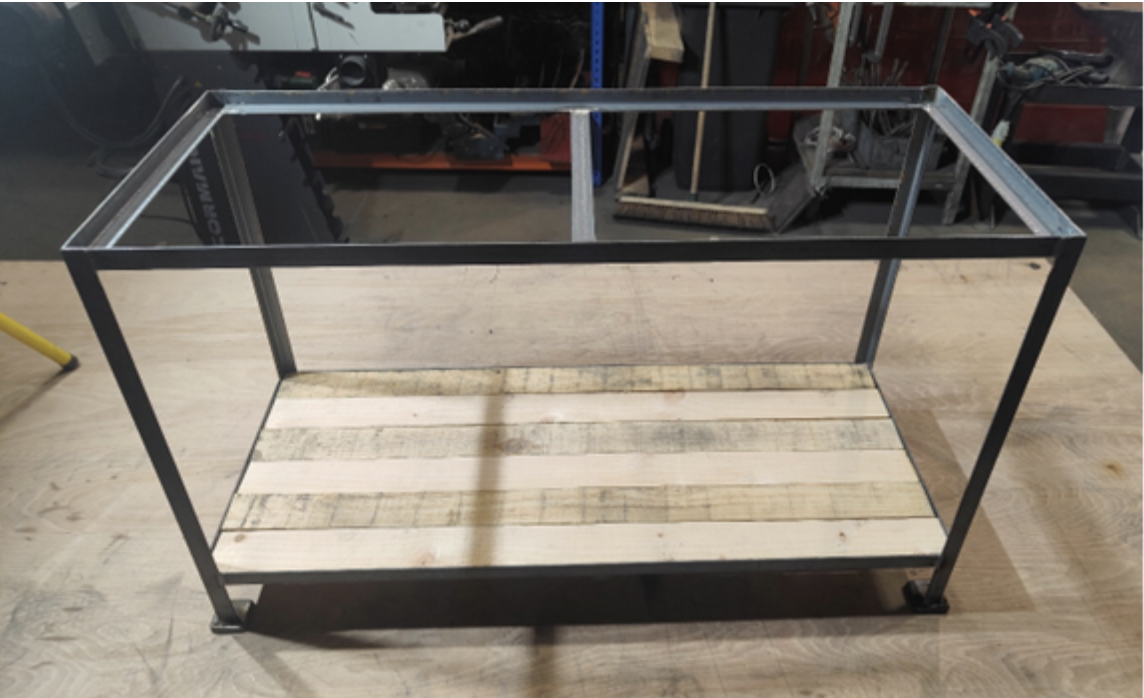 Fish tank stand or bespoke furniture. Made from 25x25x3mm mild steel angle. Finished with a pallet wood shelf.