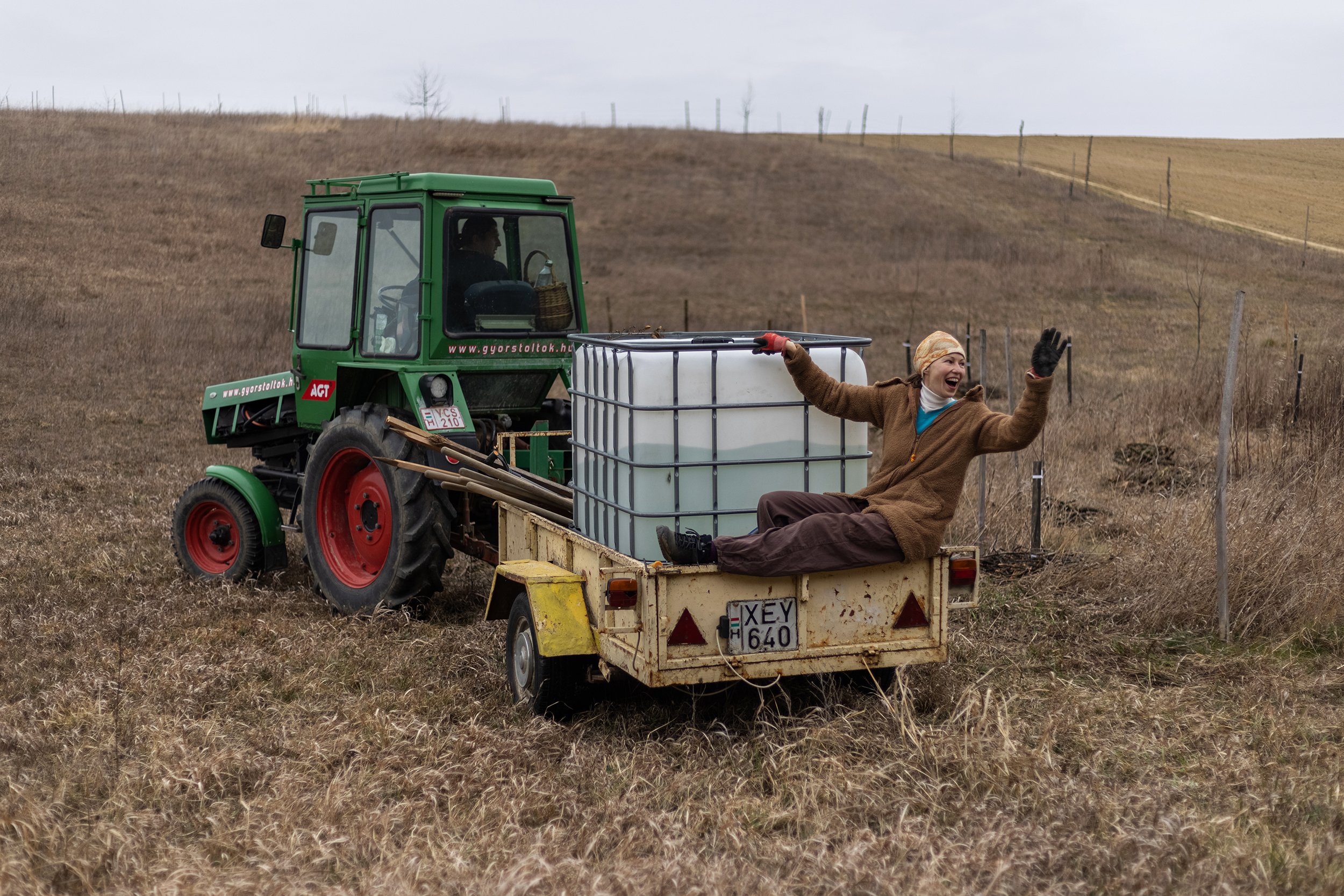  Cili jumping on the electric tractor as a stowaway on the Eco-meadow in Nyim, on March 13, 2022. Gergő, a member of the community, built the engine of a small electric car into his existing work machine. The vehicle – as part of a sustainable system