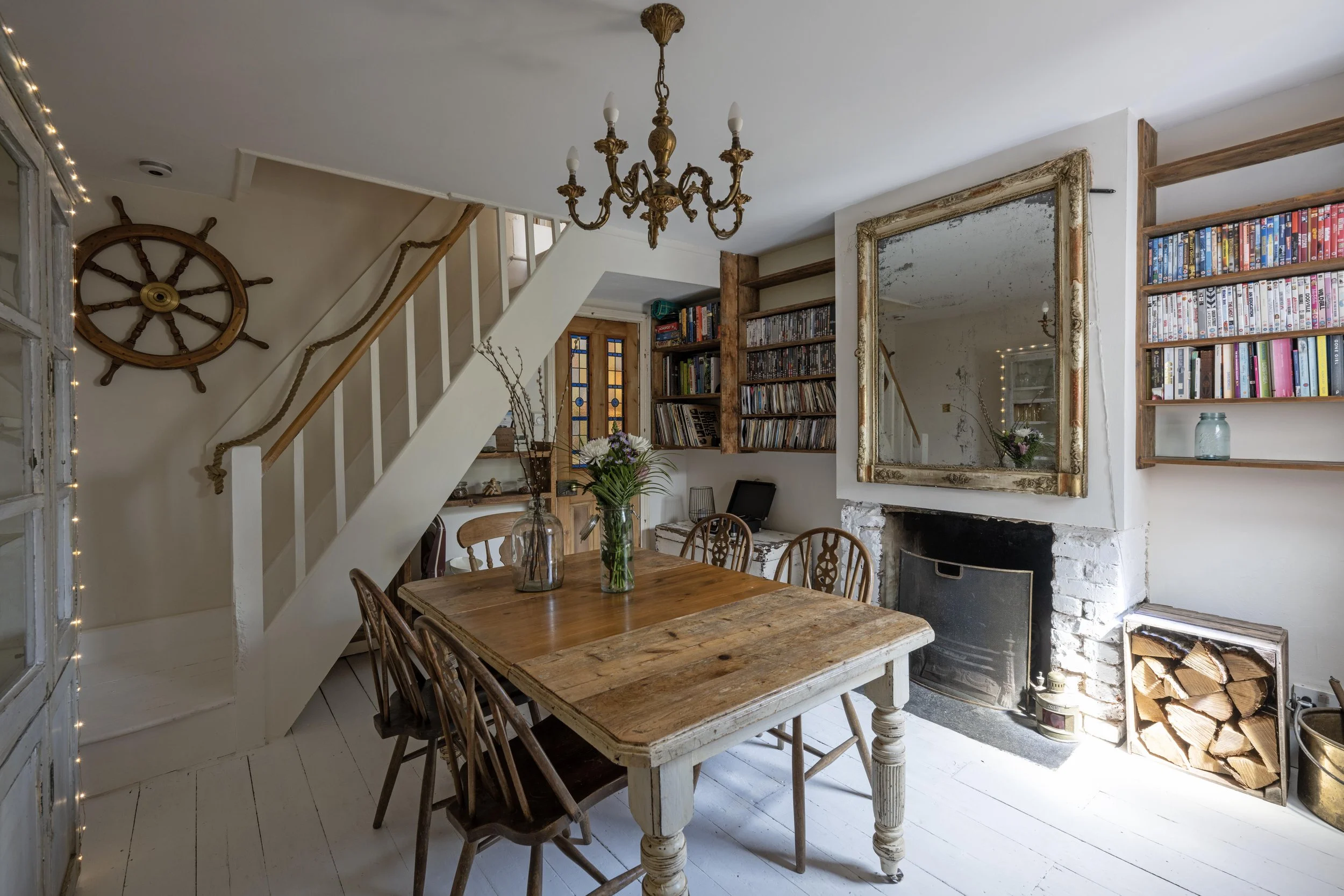 The dining room seats six people, and has a lovely French vintage chandelier and a real fire. 