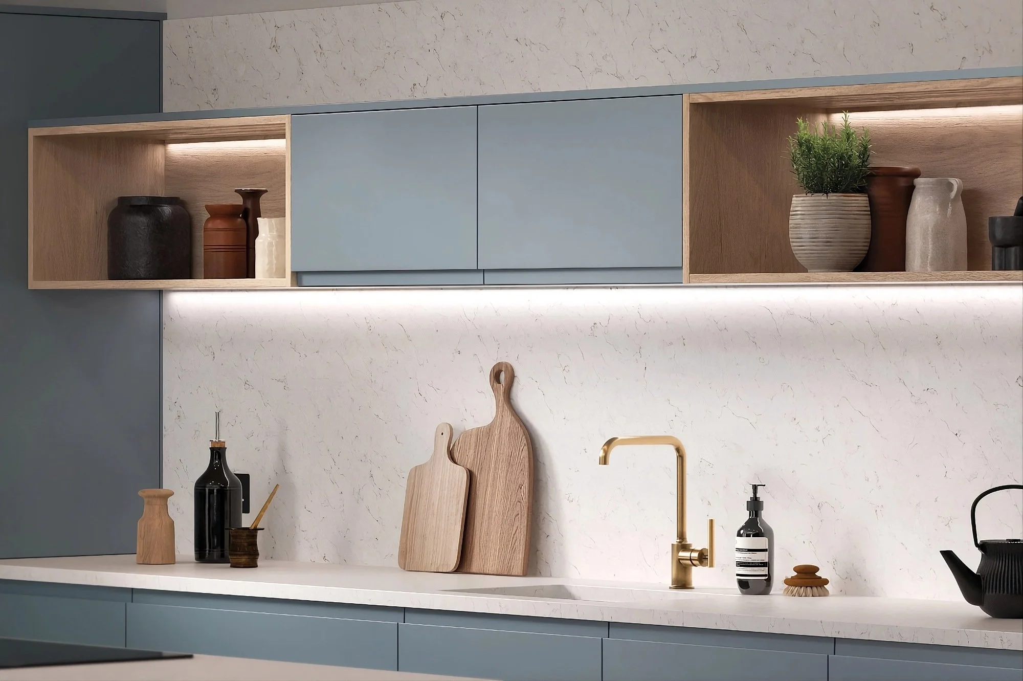 blue modern kitchen with white quartz worktops