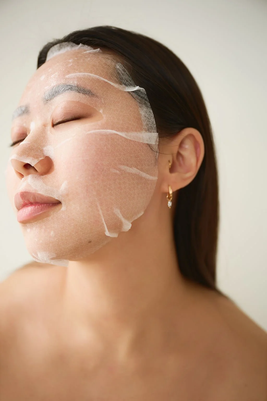 Person receiving microneedling treatment on forehead