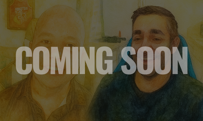 A digitally edited photo of two men sitting indoors with a yellow wall in the background, overlaid with the words 'COMING SOON' in large white and blue letters.