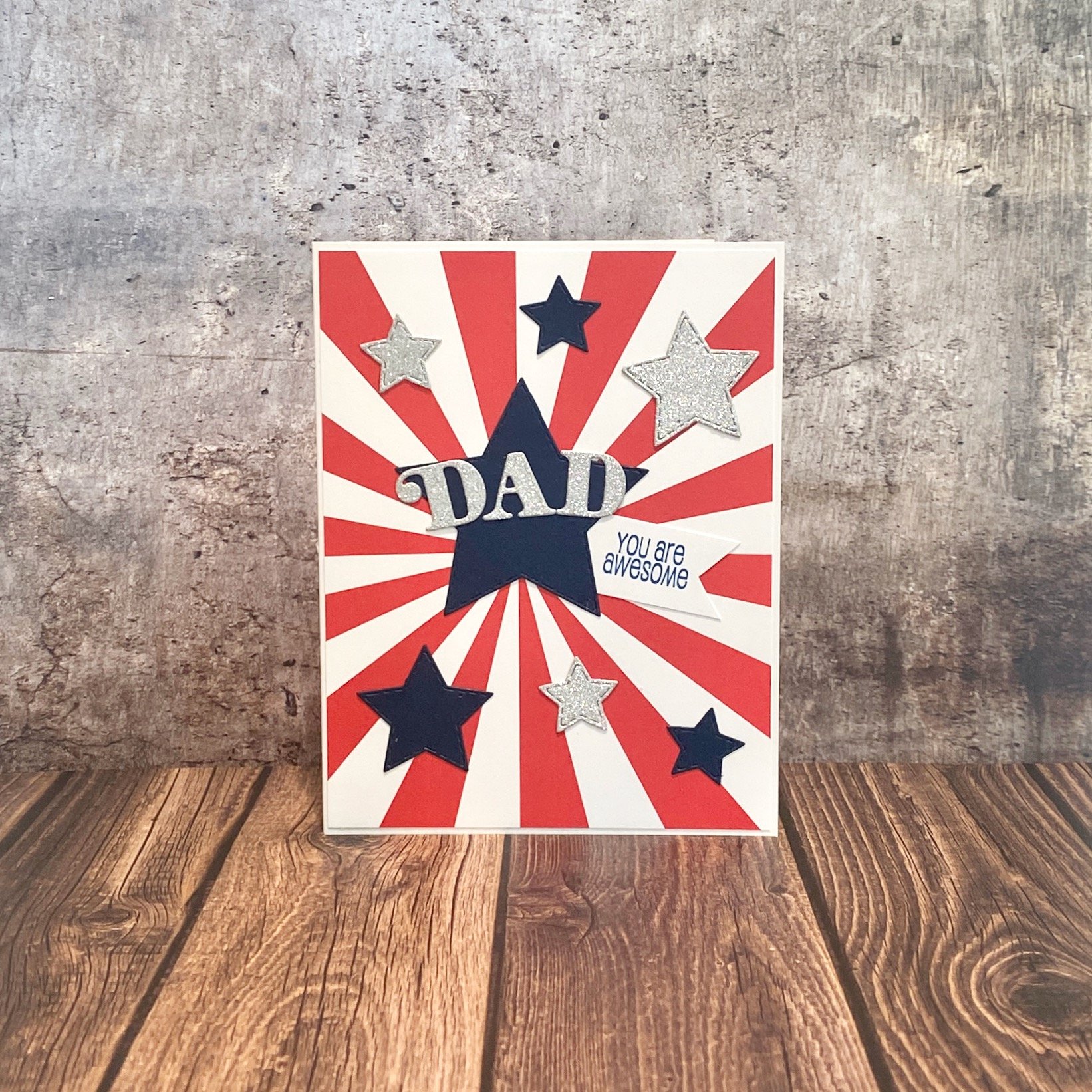 Greeting card with "DAD" and stars design.
