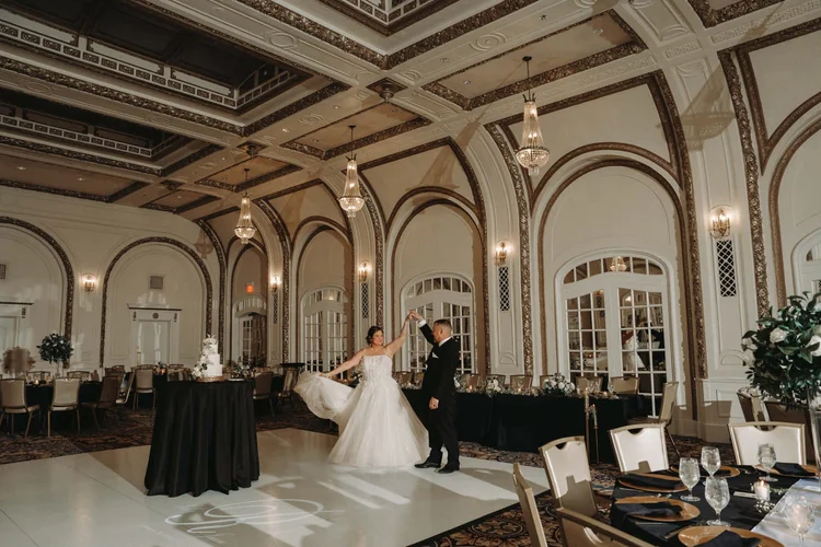 Bride and groom dance in the Gold Room at Hotel Blackhawk