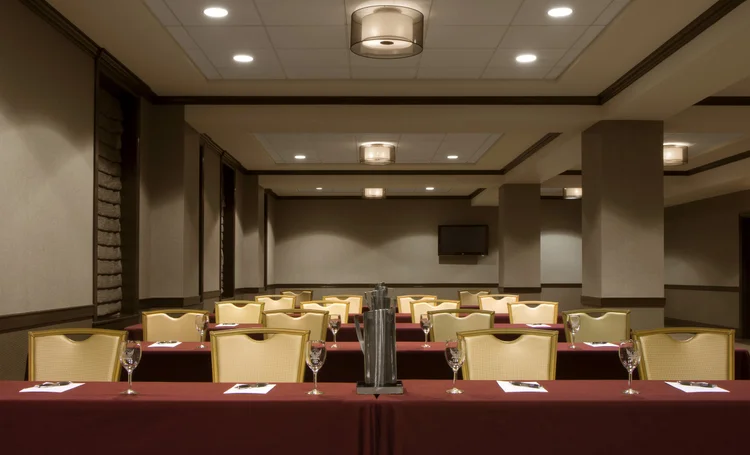 The Bettendorf Room set classroom style with red linens