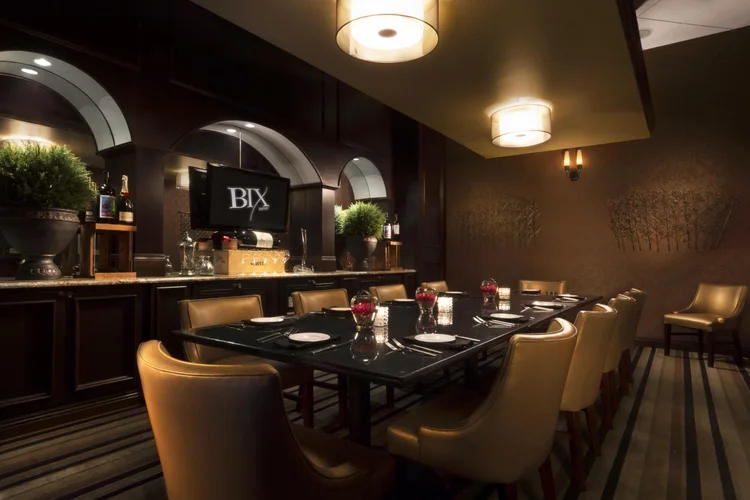 Bix Bistro private dining room with a long table and leather chairs