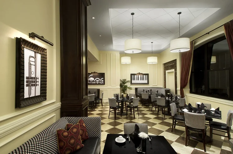 Bix Bistro dining room with checkered floors, jazz-themed art and lounge seating