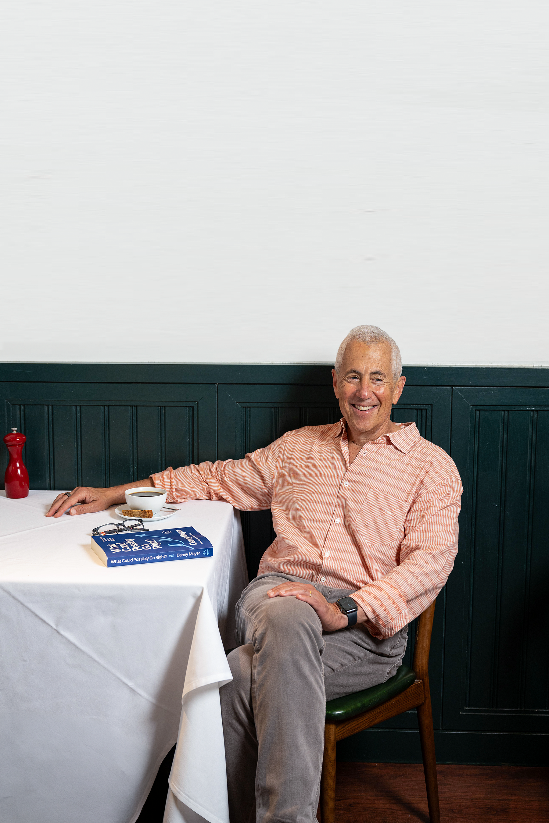 Danny Meyer seated at a restaurant table