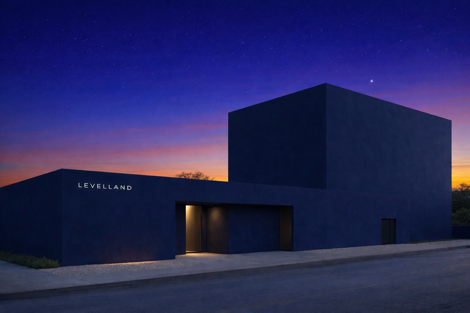 A modern dark blue building with the text 'LEVELLAND' on the side, illuminated by subtle outdoor lighting, set against a vibrant twilight sky with stars and a hint of sunset colors.