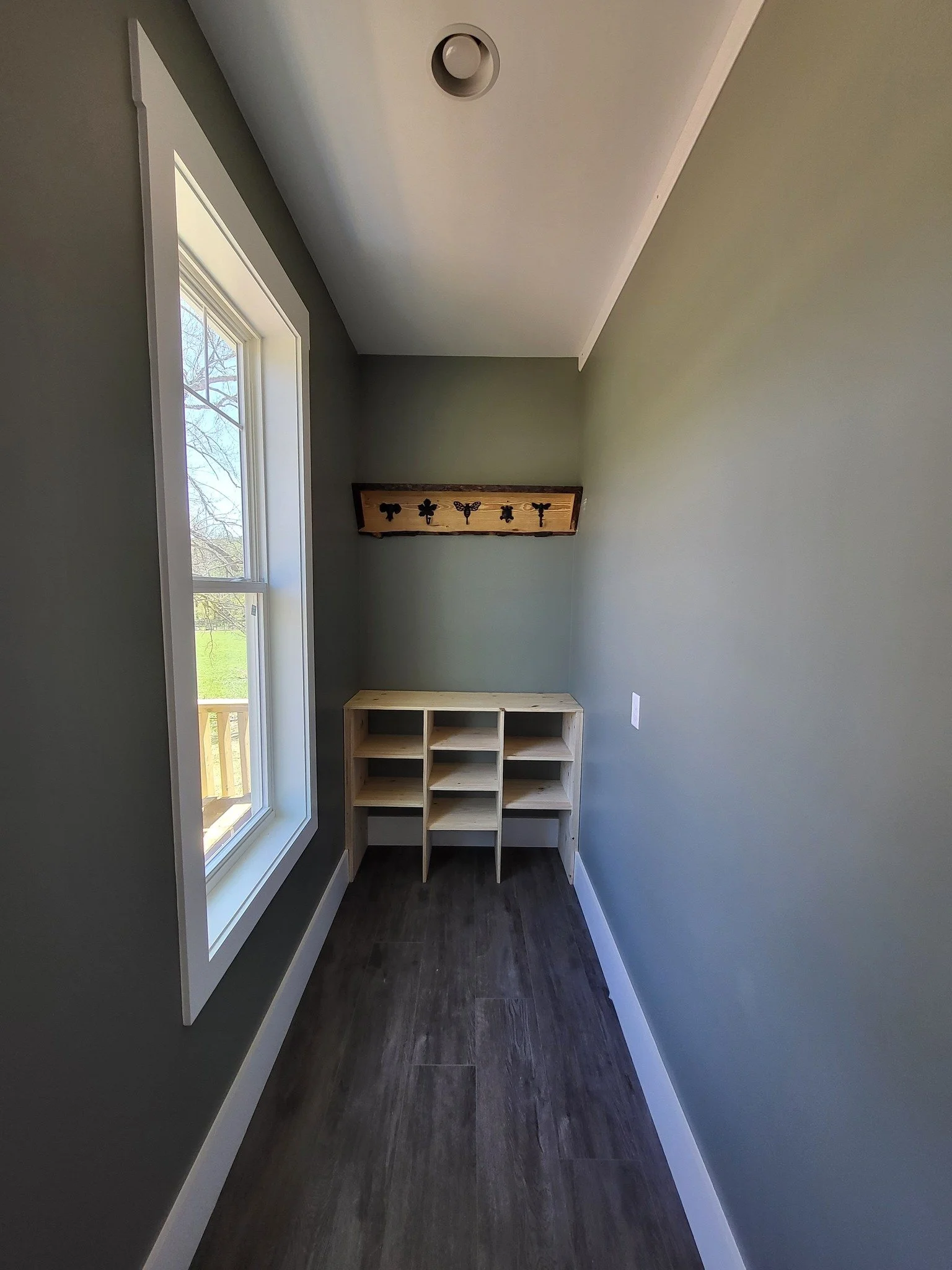 custom shelves trim olive green window.jpg