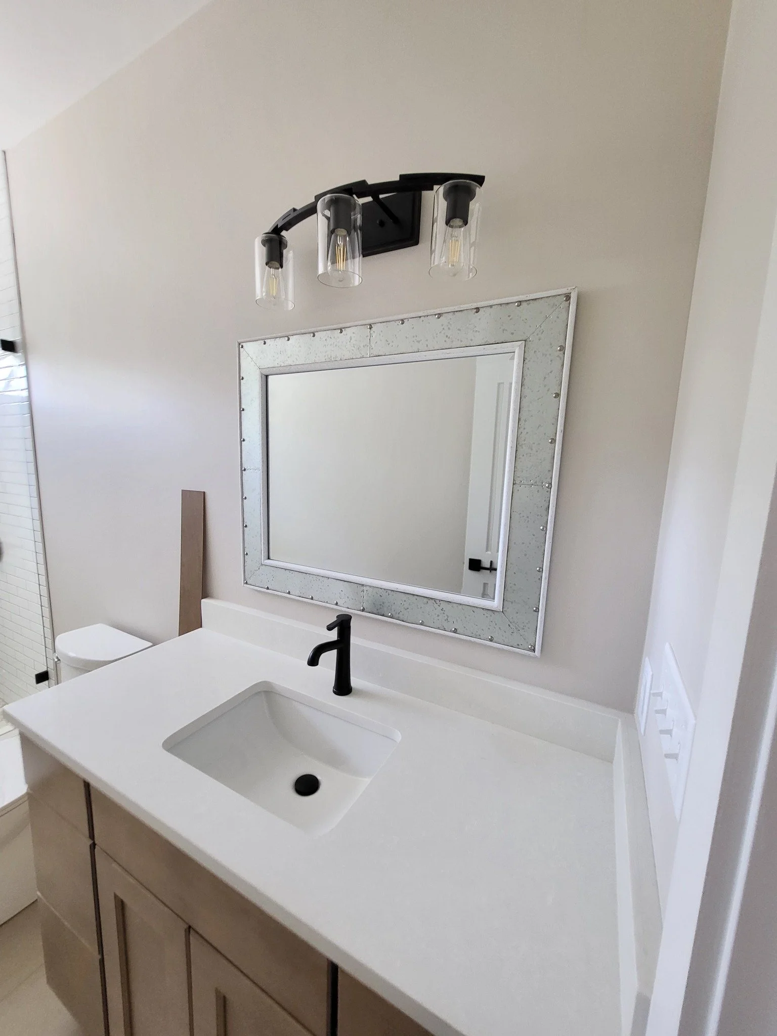 bathroom cabinet install, door installation, trim work