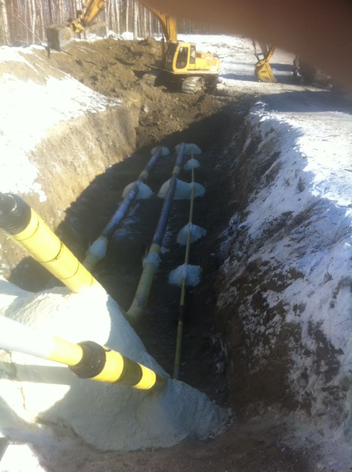 Spray foamed pillows and supports for pipeline
