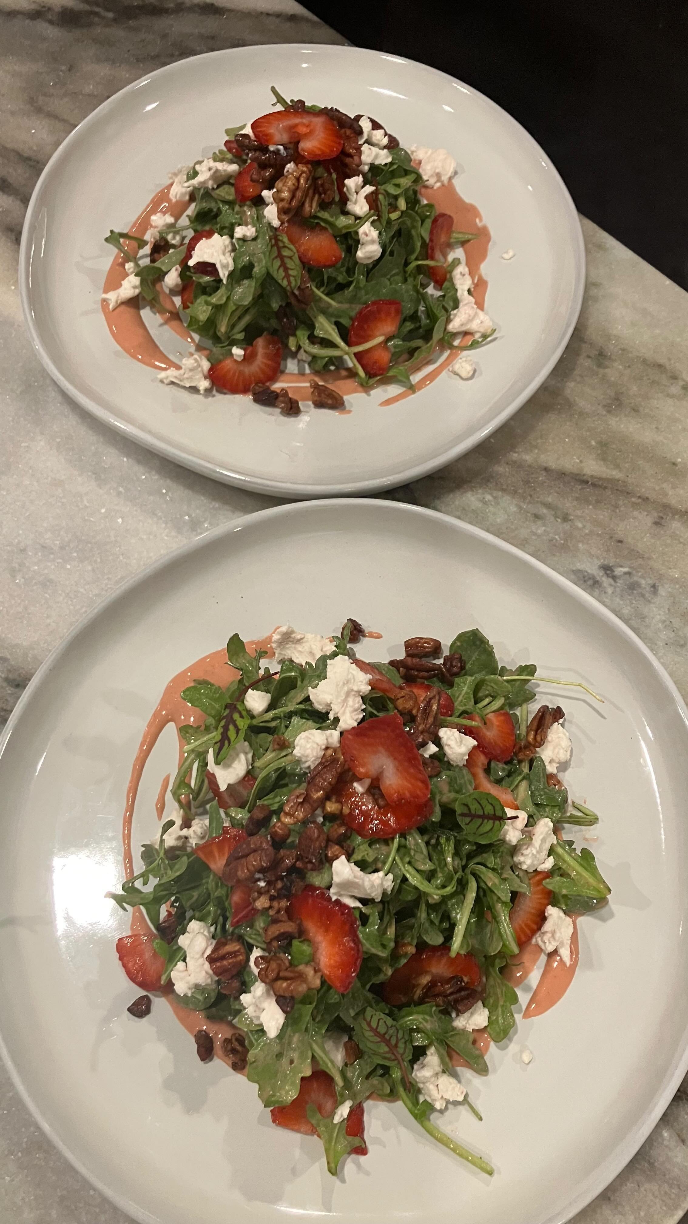 Plating Strawberry Salad, Strawberry Balsamic Vinaigrette, Strawberry Goat Cheese, Candied Pecans, Local Arugula,and Sliced Local Strawberries. #rvacatering #rvafoodie #rvaprivatechef #rvachef #rva #catering #richmond