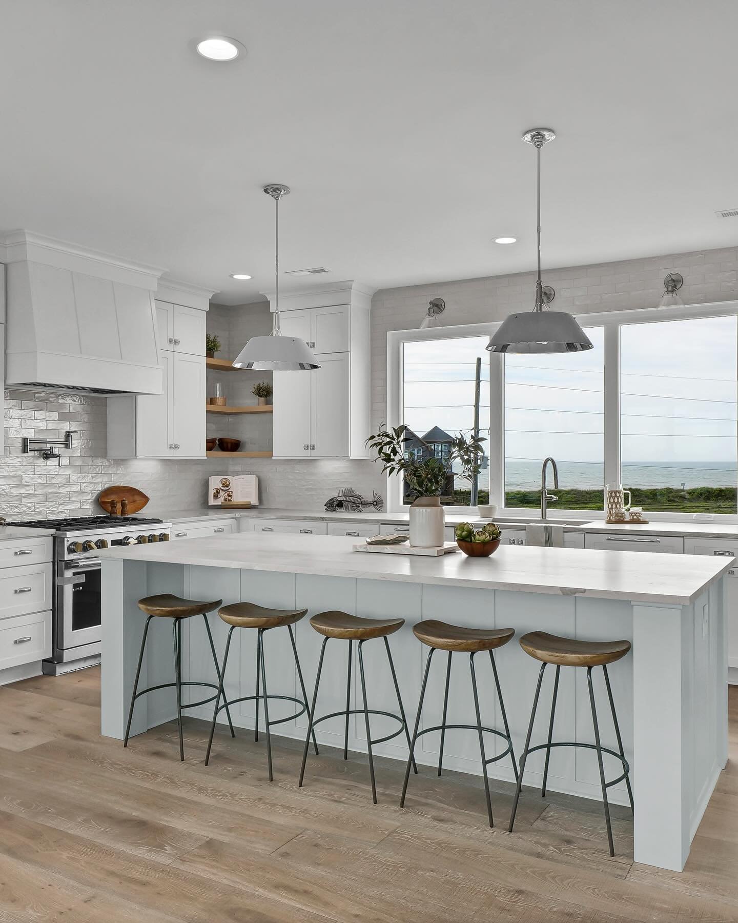 A stunning North Topsail Beach kitchen.

With ocean views around every corner, this space is full of light and serenity. We love the combination of beautiful nickel hardware, open shelving and our @kraftmaid Cabinetry.

#kitchendesign #kitcheninspo #