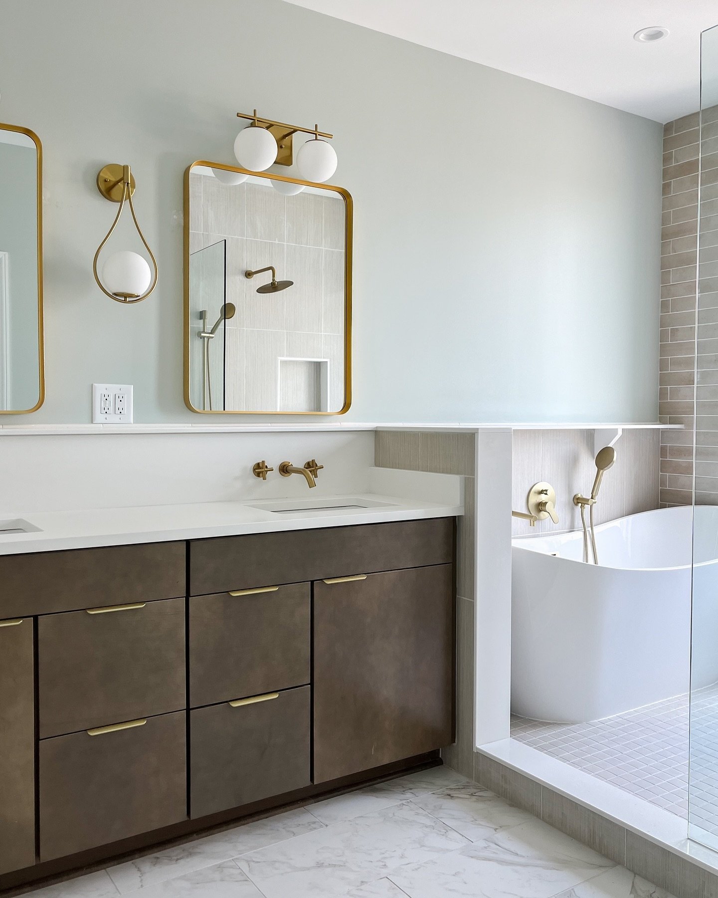 Step into elegance in this serene bathroom complete with our @waypointlivingspaces cabinetry in Maple Latte, with beautiful brass hardware and fixtures.

Ready to elevate your bathroom experience? We&rsquo;d love to help.

&mdash;
#bathroomdesign #ba