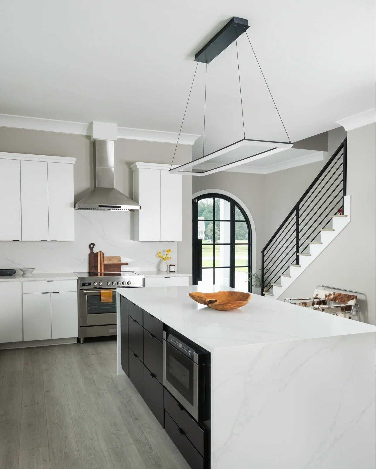 Black, white, and modern all over. We are in love with this latest home reveal featuring our @waypointlivingspaces cabinetry, @ruvati and @moeninc  fixtures and more.

With beautiful trim details and stunning arched doors, this custom build by @chann