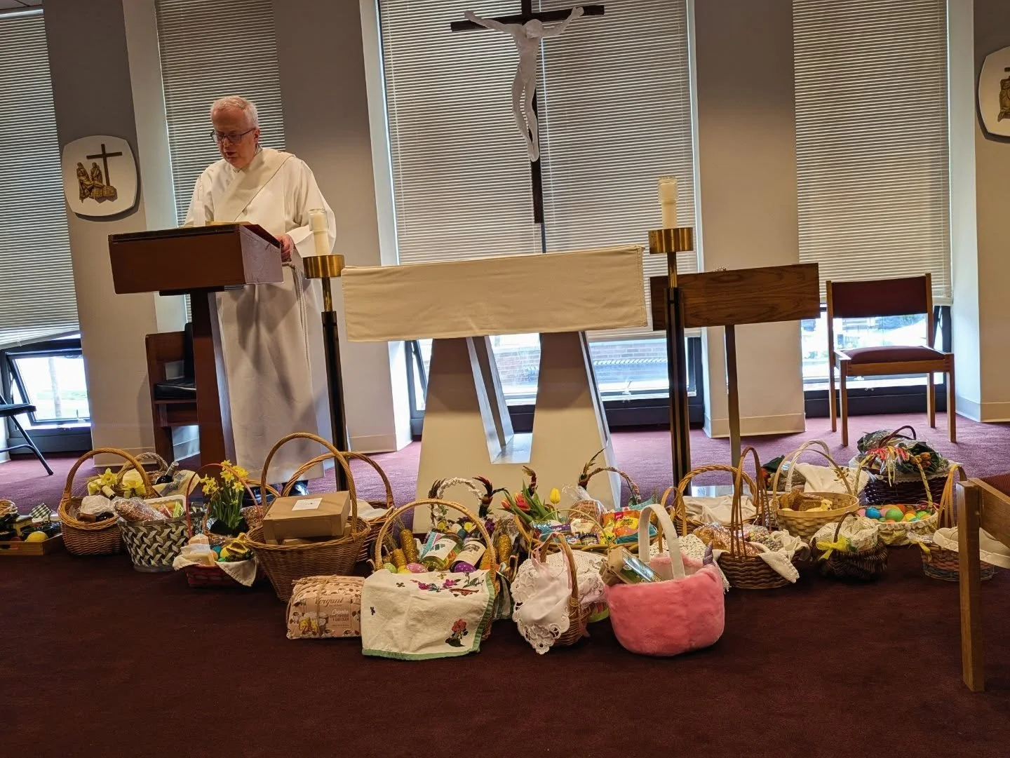 This Holy Saturday morning, following a beautiful morning prayer service, the parish got to work preparing the church for our Risen Lord. We likewise invited parishioners to gather in the chapel for our Easter Food Blessing tradition as families prep