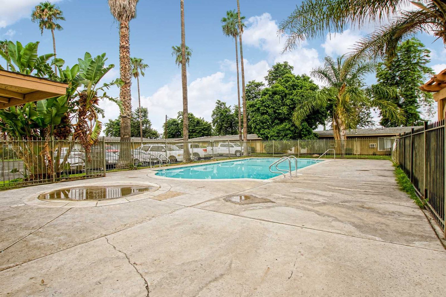 This image captures an alternate angle of the community's fenced-in pool area.