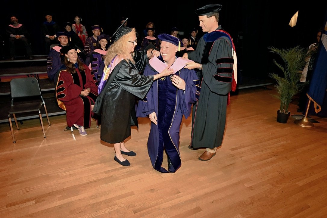 Being hooded at LSU Graduation 2024