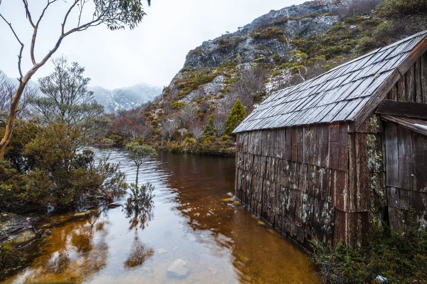 We faced some pretty wild weather while visiting this stunning location - Crater Lake, in the Cradle Mountain NP. 

Heavy snow from the previous day was melting fast so the track up was like walking up a running stream. 

We stopped to enjoy a few wa