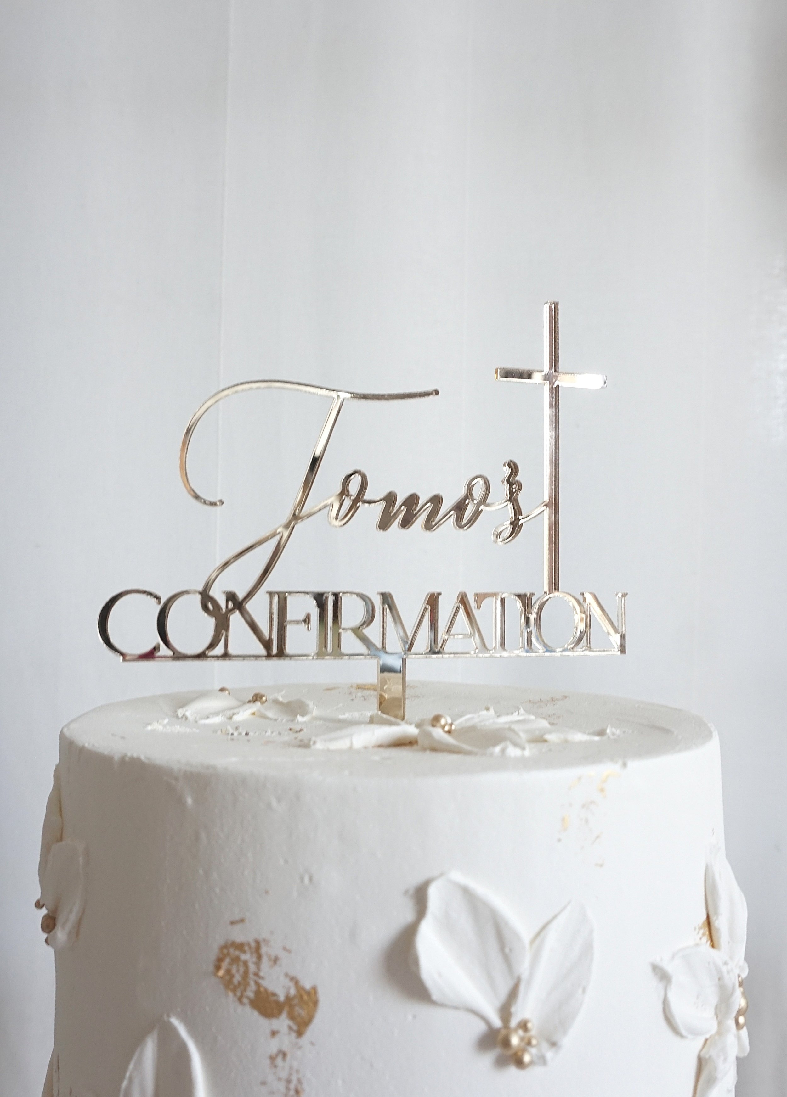 The Elegant Combination cake topper designed for Tomo's Confirmation. It has a cross added to it to fit the religious event.