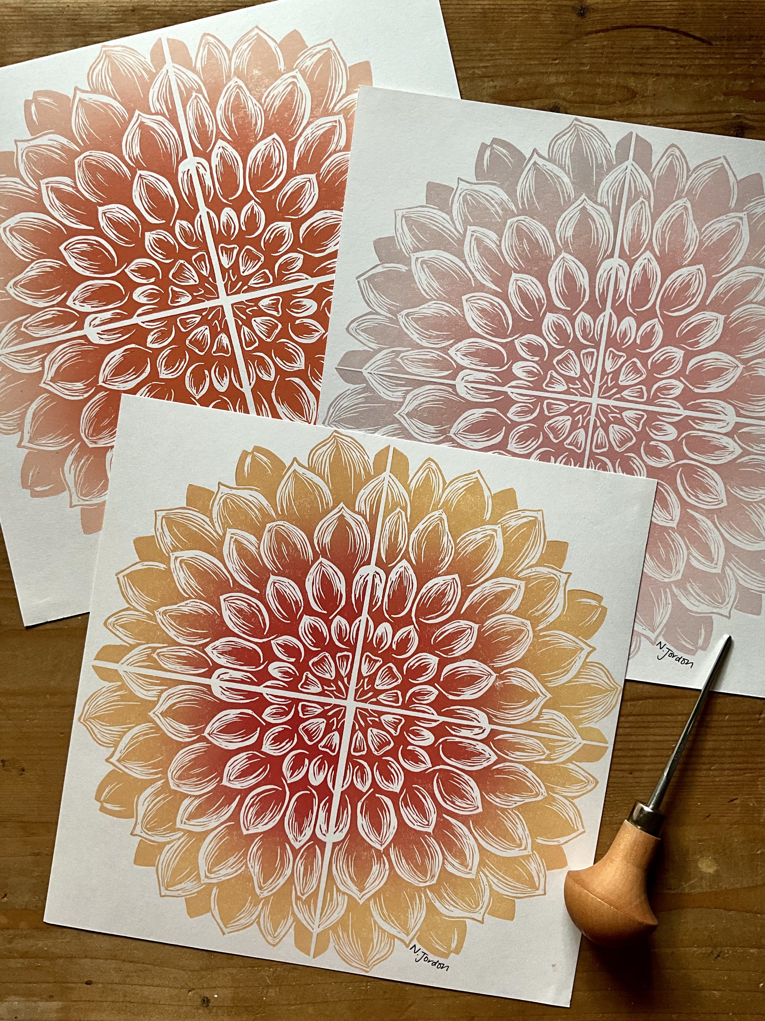 Full dahlia original lino cut print, in 21x21cm square. Hand printed in range of ombrés. Photo also shows lino carving tool.