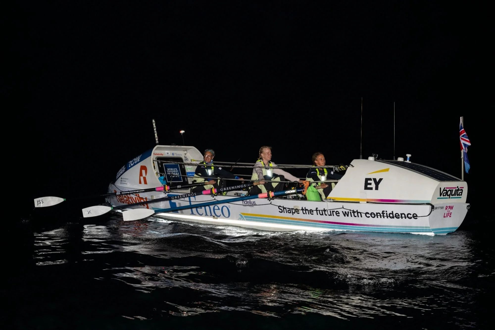 Felicity Ashley and the Row For Life crew rowing through the night during their unsupported 2,800-mile Pacific Ocean crossing.