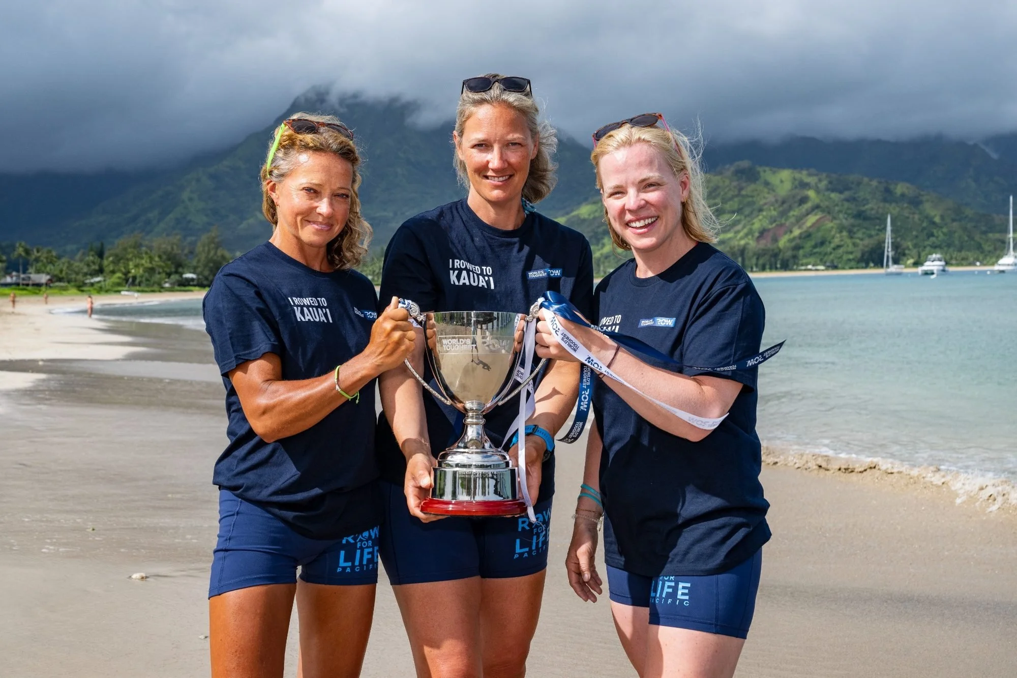 Felicity Ashley and her Row For Life teammates proudly holding their winners' trophy in Kaua'i, Hawaii, after winning the women's race in the World's Toughest Row Mid-Pacific 2026.