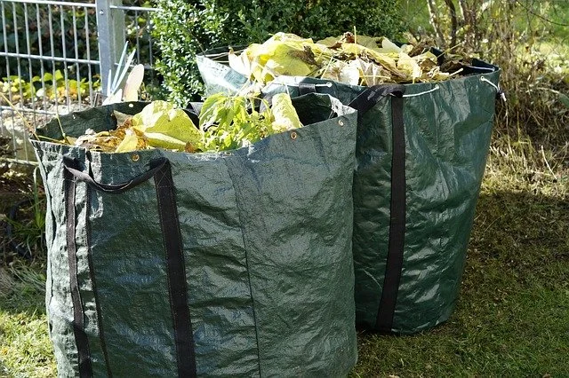 Gardening waste in large green bags