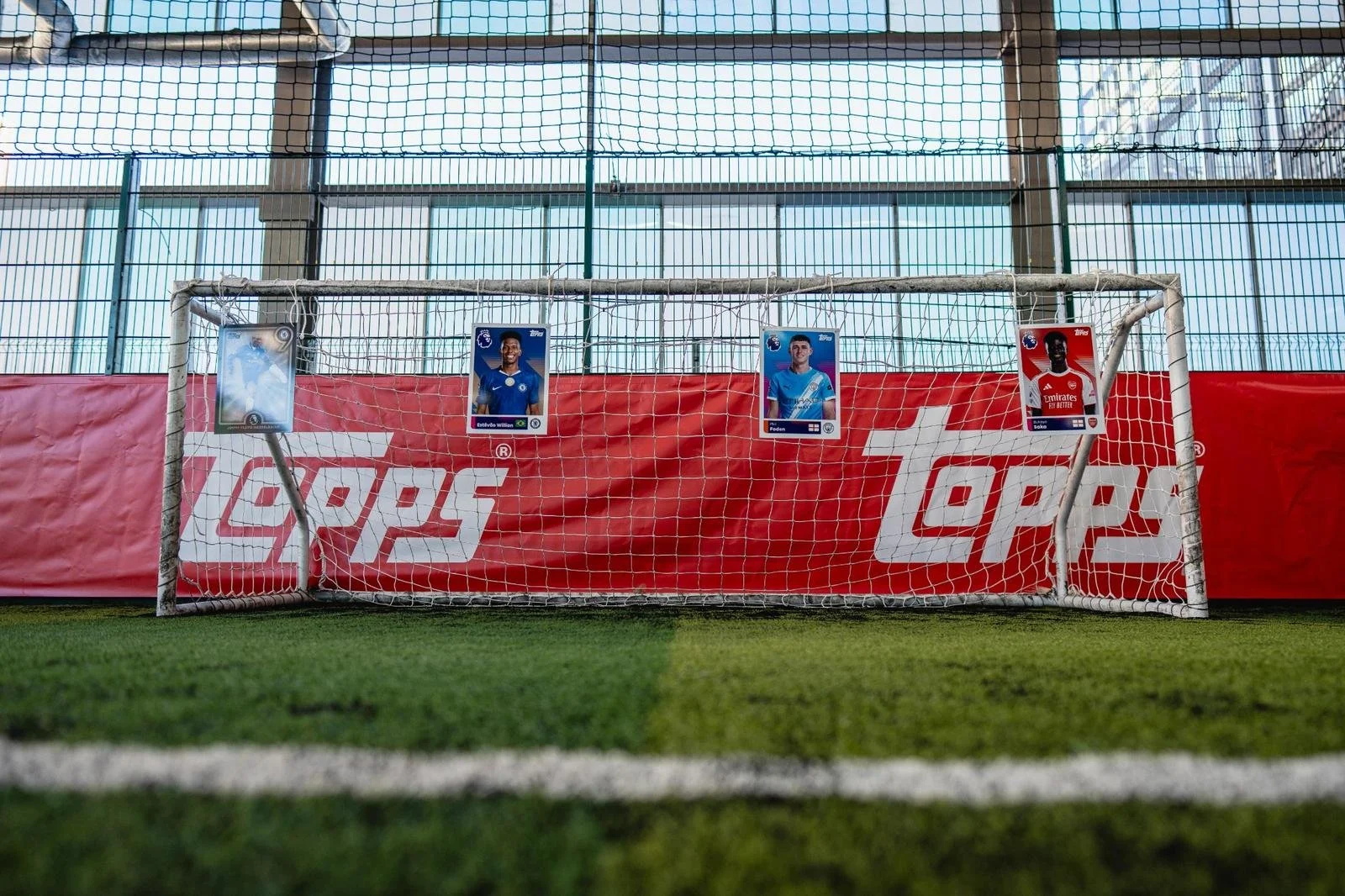 Football goal with Topps trading cards displayed during a brand activation event.