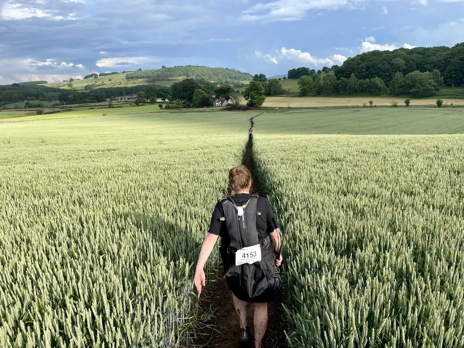 Walkers pacing themselves through the countryside during a long-distance walking challenge